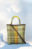 Woven and perforated leather bag with beaded handles  image