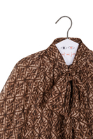 Chocolate brown geometric tile print shirt image