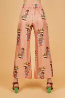 Pantaloni in seta rosa cipria con stampa donna floreale image