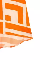 Bright orange and ivory geometric print blouse image