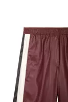 Pantaloni in ecopelle color vino con righe image