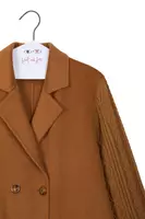 Camel coat with cable knit sleeves  image