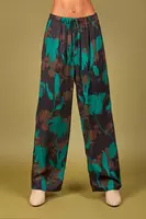 Emerald green and black floral silhouette print trousers  image